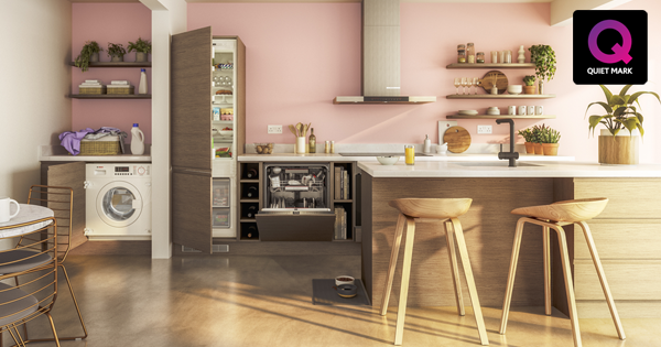 Open plan kitchen and dining area featuring a range of integrated appliances. Including a washing machine, dishwasher, fridge freezer and an extractor.